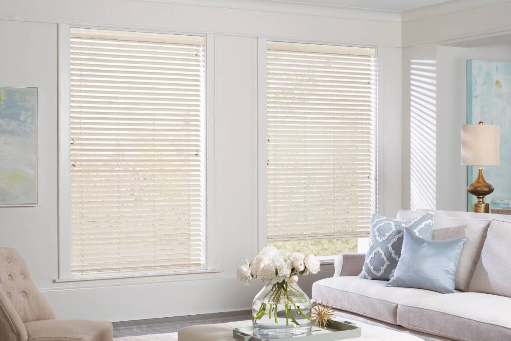 Hunter Douglas EverWood® Faux Wood Blinds on windows in a bright and airy living room