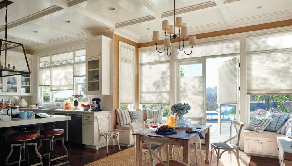 Custom window treatments from Hunter Douglas on several windows in a kitchen and dining area