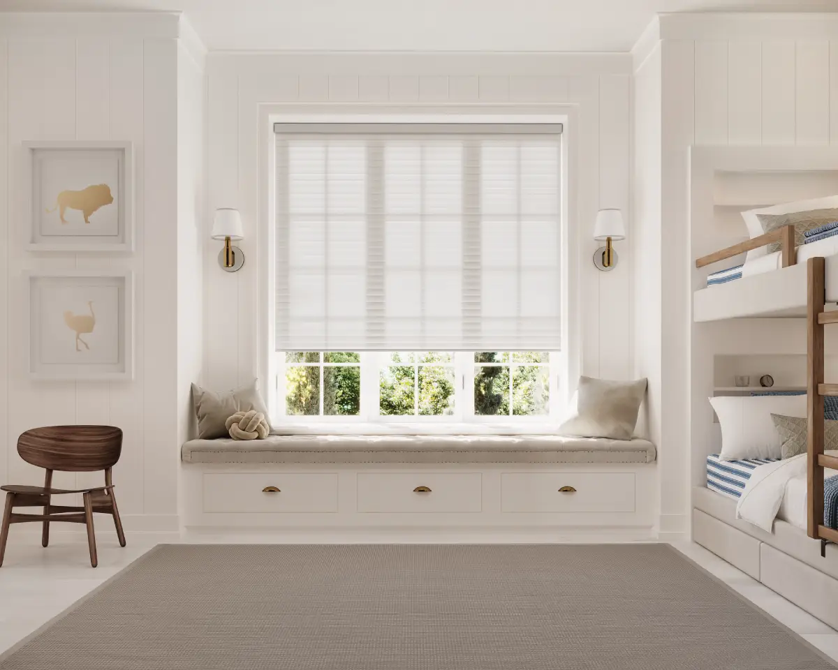 Hunter Douglas Sonnette® Cellular Roller Shades on a window in a child's bedroom with bunk beds