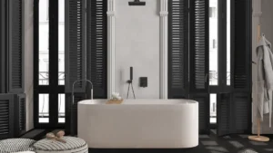 Custom black shutters in a bi-fold style on large, tall windows in a chic bathroom